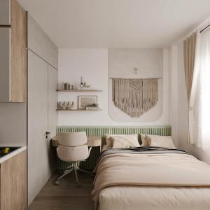 a bedroom with a bed and a chair and a desk at The Urban Westlake Apartment in Hanoi +16 photos