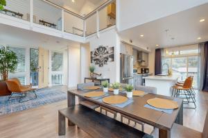 a dining room and living room with a table and chairs at Modern Yosemite Retreat in Groveland