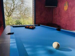a blue pool table with a ball on it at Maison lumineuse La Forêt-Fouesnant proche plage, golf, avec salle de détente et 5 chambres - FR-1-481-158 in La Forêt-Fouesnant