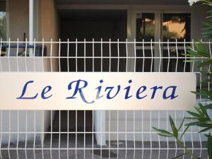 a sign that reads le riviera on a building at Appartement Le Lavandou, 1 pièce, 4 personnes - FR-1-251-776 in Le Lavandou