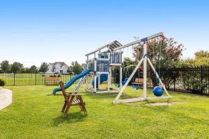 a park with a playground with a slide at Bethany Bay --- 30224 Driftwood Court Unit #7504 in Ocean View