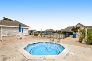 a swimming pool in a yard with a patio at Bethany Bay --- 30224 Driftwood Court Unit #7504 in Ocean View