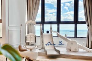 a room with a view of the ocean at Bali Residences 6-8pax I Water Park I 5minsJonkerSt Managed by Alviv Management in Malacca