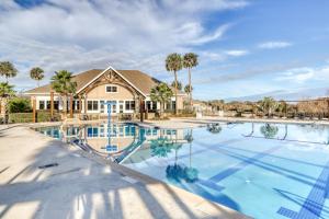 a large swimming pool in front of a house at Nature Retreat in Seabrook Island