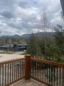 a balcony with a view of the mountains at Ski-In Chalet: Private Hot tub, Bonus Bunk House in Fernie
