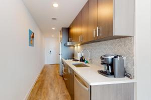 a kitchen with a sink and a coffee maker on a counter at Pioche Village #1226 in Park City