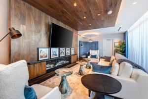 a living room with a fireplace and a tv at Pioche Village #1226 in Park City