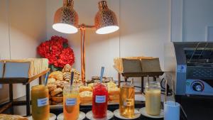 a table topped with lots of different types of food at Sugar Marina Hotel - FASHION - Kata Beach in Kata Beach