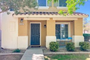 a house with a blue door in front of it at Garden Breeze in Gilbert