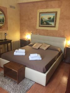 Ένα ή περισσότερα κρεβάτια σε δωμάτιο στο B&B Etna House +37 φωτογραφίες