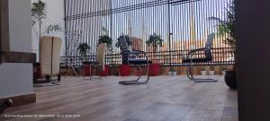 a waiting room with chairs in front of a wall at HOTEL AYODHYA PAYING GUEST in Ayodhya
