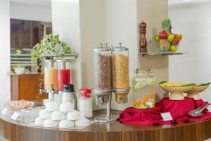 a counter with many containers of food and other ingredients at Monarch Luxur - Infantry Road in Bangalore