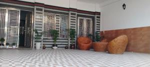 a group of chairs and plants in front of a building at HOTEL AYODHYA PAYING GUEST in Ayodhya