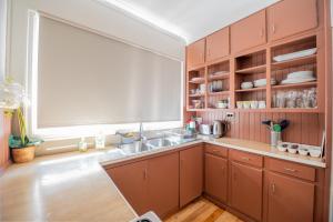 a kitchen with a sink and a large window at 29 in Corio