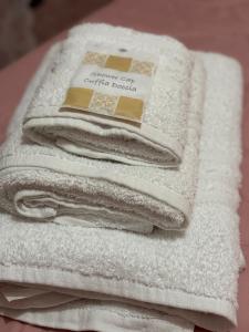 a pile of white towels stacked on top of each other at MG Luxury Home in Naples