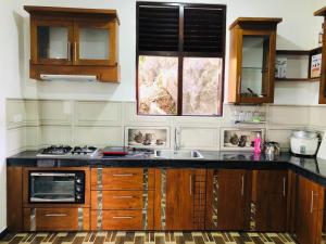 a kitchen with a sink and a counter top at The villa on the Rock in Talpe