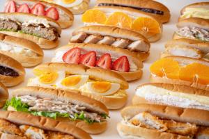 a bunch of sandwiches with fruit on them at The OneFive Osaka Namba Dotonbori in Osaka