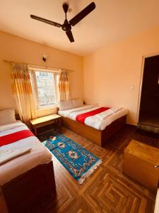 Vuode tai vuoteita majoituspaikassa Hotel Global Inn