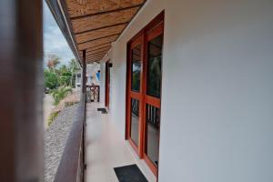 a view from the hallway of a house with a door at Copacabana Siargao in General Luna