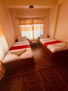 Vuode tai vuoteita majoituspaikassa Hotel Global Inn