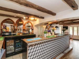 a bar with a counter top in a room at Chalet Log Cabin L15 in Ilfracombe