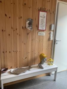 a wooden wall with a bench in a room at Unique private cabin in Lofoten in Leknes