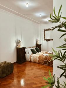 Postel nebo postele na pokoji v ubytování Residenza Tritone Luxury Guest House Trevi Fountain