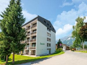 a white building with the words rock hotel at Apartment in Ellmau with Ski-In Access in Ellmau