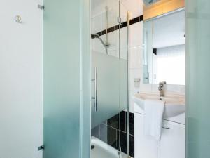 a bathroom with a sink and a mirror at Apartment in Ellmau with Ski-In Access in Ellmau +32 photos