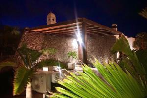 a building with a light on the side of it at Beautiful holiday home in Playa Blanca with pool in Playa Blanca