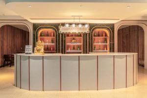 a rendering of the lobby of a luxury hotel at Blue Cabin Hotel Formerly A-ONE New Wing Hotel in Pattaya