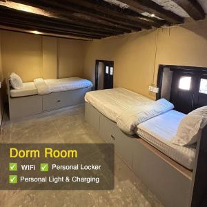 A bed or beds in a room at Heranya Hostel