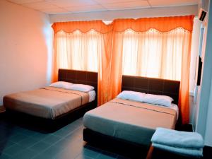 Postel nebo postele na pokoji v ubytování OYO 90963 Gest Inn