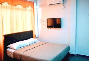 Postel nebo postele na pokoji v ubytování OYO 90963 Gest Inn