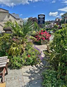a garden with plants and flowers on a street at Valley Bar in Scarborough