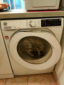 a washing machine with a microwave on top of it at Discesa Marina in Ventimiglia +8 photos