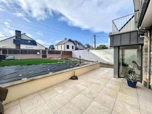 a view of a house with a roof at Maison à 100m de la plage, jardin privé, wifi gratuit, proche commerces et activités balnéaires - FR-1-361-113 in Jullouville-les-Pins