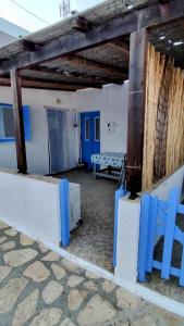 a room with blue benches in a building at Calliope's house in Lipsoi
