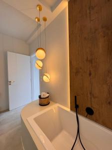 a large bath tub in a room with at Poema Antiparos in Antiparos
