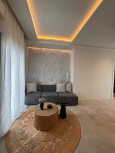 a living room with a couch and a coffee table at Poema Antiparos in Antiparos