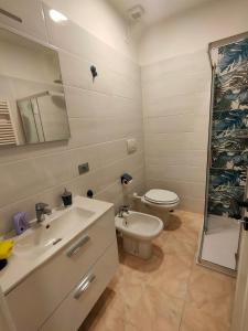a bathroom with a toilet and a sink at Discesa Marina in Ventimiglia