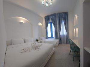 Voodi või voodid majutusasutuse Ipoh Santorini Hideaway - Hotel Inspired toas