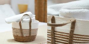 a basket filled with towels on top of a table at SHANO'S Apartment - Free Parking in Sarandë +34 photos