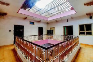 a large room with a balcony with a large skylight at SPOT ON Mishra Guest House in Varanasi