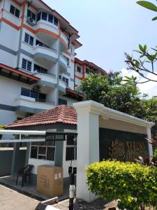 a building with a sign in front of it at 3 Bedrooms 2 Bathrooms Seruni Apartment, Serendah Gold Resort, Persiaran Meranti Selatan, Ulu Selangor, 48200 in Serendah