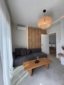 a living room with a couch and a table at Poema Antiparos in Antiparos