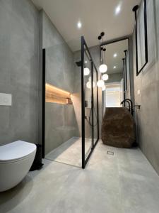 a bathroom with a sink and a toilet in it at Poema Antiparos in Antiparos