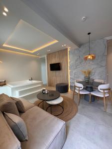 a living room with a couch and a table at Poema Antiparos in Antiparos