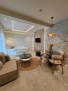 a living room with a couch and a table at Poema Antiparos in Antiparos