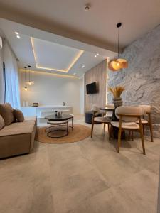 a living room with a couch and a table at Poema Antiparos in Antiparos